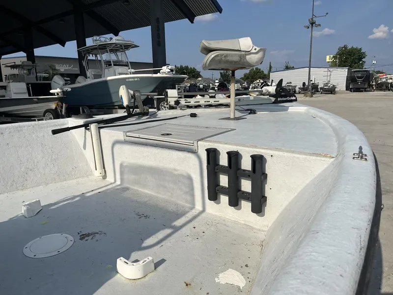 Slide: The Image of Champion 230-RV boat console, 2002 model, with American flag in background. - 12