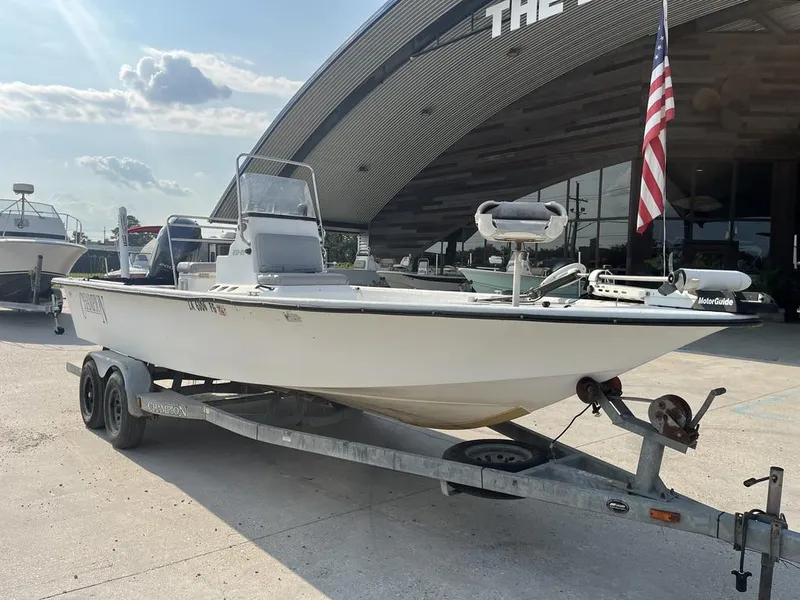 Slide: The Image of 2002 Champion 230-RV boat with Yamaha outboard motor on trailer. - 14