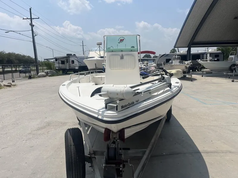 Slide: The Image of 2000 Robalo 2000 boat on trailer, parked outdoors under clear sky. - 7