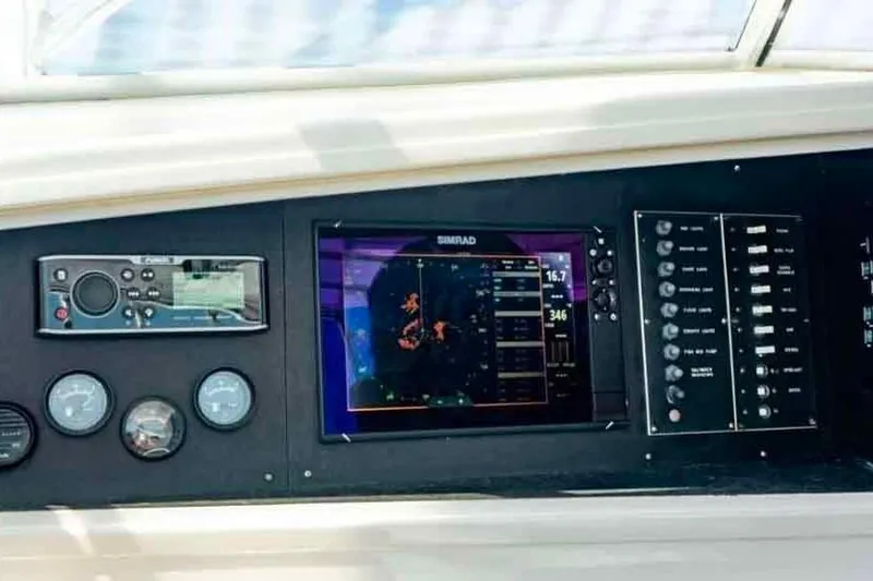 Slide: The Image of Control panel of 1993 Buddy Davis Express Custom Carolina boat with navigation and monitoring systems. - 14