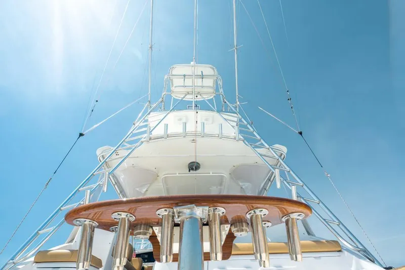 Slide: The Image of 1993 Buddy Davis Express Custom Carolina yacht, viewed from below against a clear blue sky. - 15