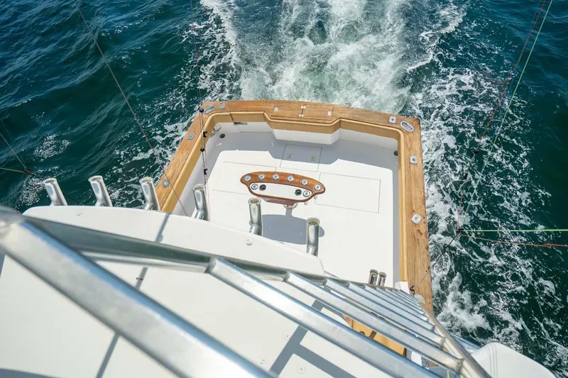 Slide: The Image of 1993 Buddy Davis Express Custom Carolina yacht cruising on open water. - 18