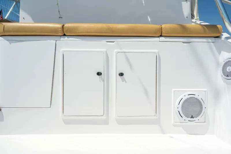 Slide: The Image of 1993 Buddy Davis Express Custom Carolina boat with storage compartments and cushioned seating. - 20