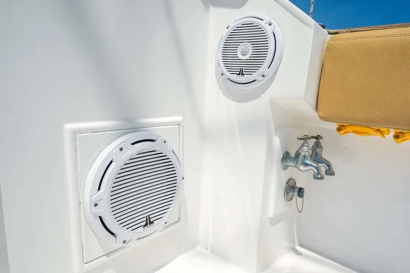 Slide: The Image of 1993 Buddy Davis Express Custom Carolina boat speakers and faucet on deck. - 21