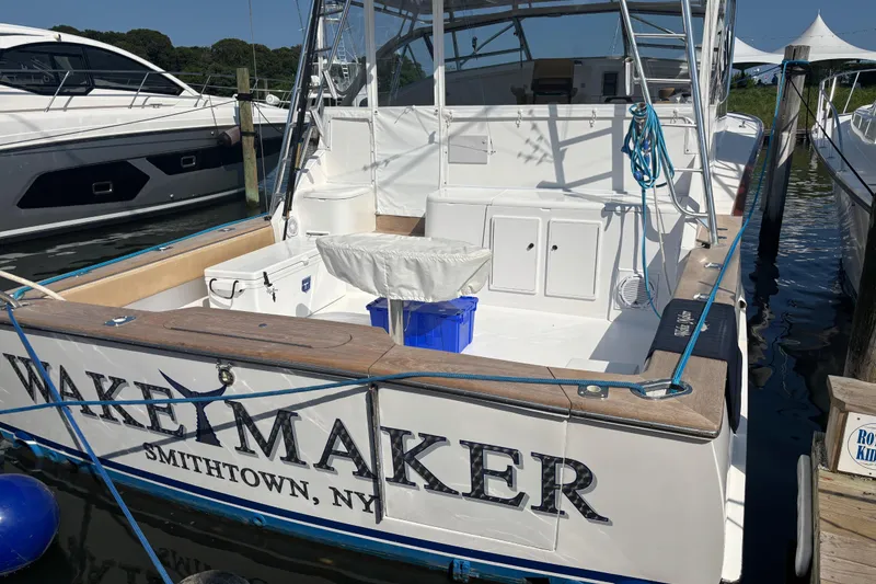 Slide: The Image of 1993 Buddy Davis Express Custom Carolina boat docked in Smithtown, NY marina. - 28