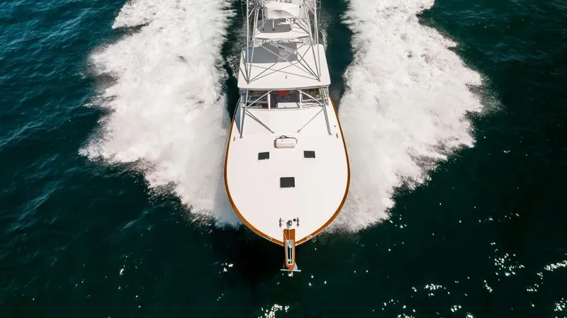 Slide: The Image of 1993 Buddy Davis Express Custom Carolina yacht cruising on open water. - 3