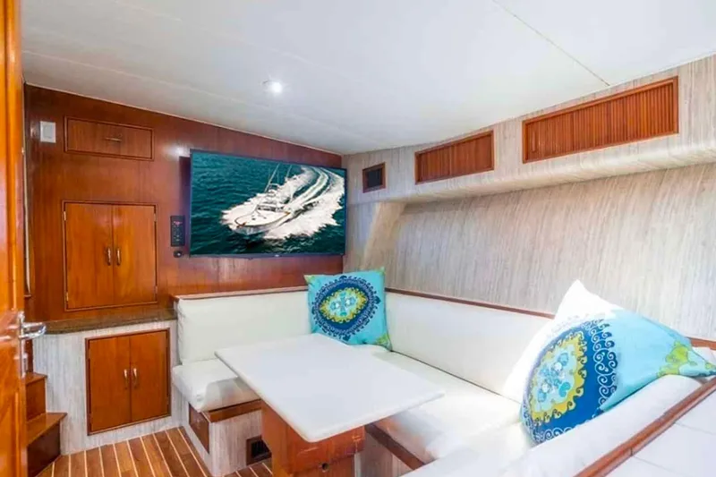 Slide: The Image of Luxurious interior of 1993 Buddy Davis Express Custom Carolina yacht with cozy seating and TV. - 6