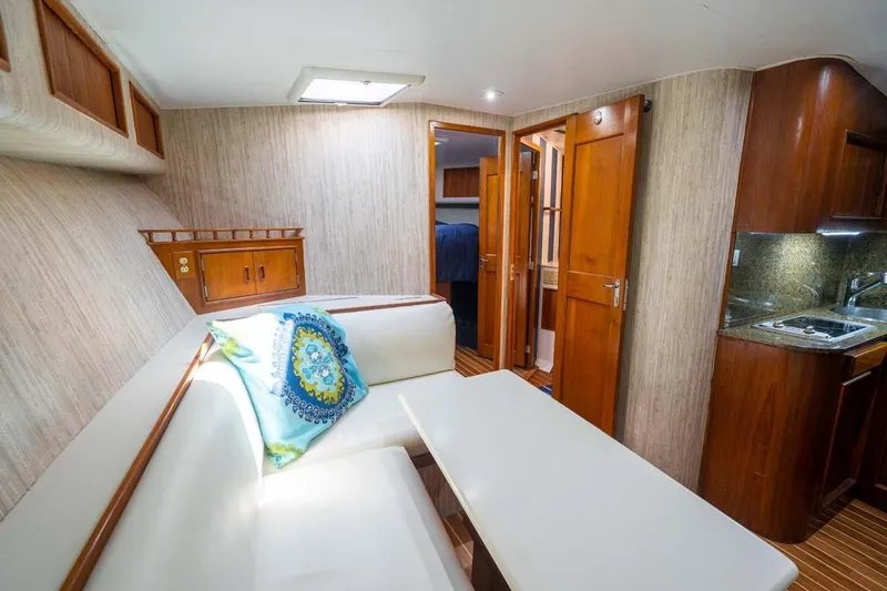 Slide: The Image of Interior of 1993 Buddy Davis Express Custom Carolina yacht with cozy seating and kitchenette. - 7