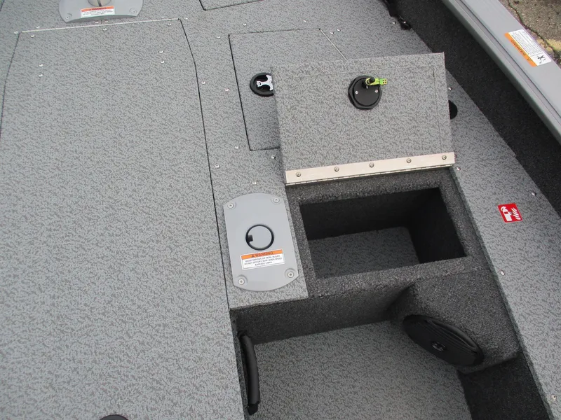 Slide: The Image of 2025 Lund Pro Guide 1875 boat interior with storage compartments and safety features. - 17