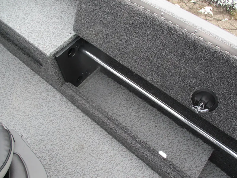 Slide: The Image of 2025 Lund Pro Guide 1875 boat interior storage compartment with rod holder. - 20