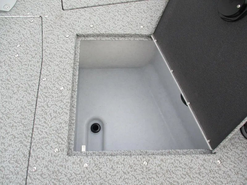 Slide: The Image of 2025 Lund Pro Guide 1875 boat storage compartment, open and empty. - 5