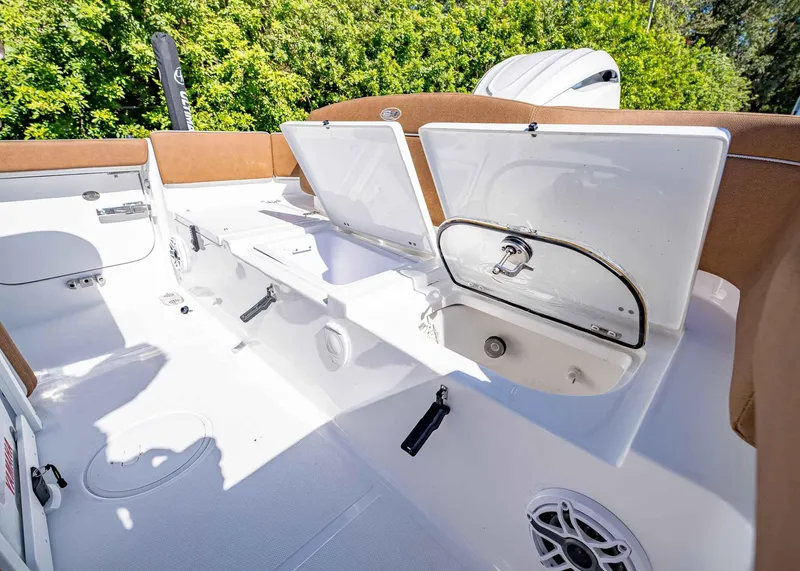 Slide: The Image of 2025 Sea Hunt Ultra 255 SE boat interior with open storage compartments. - 13