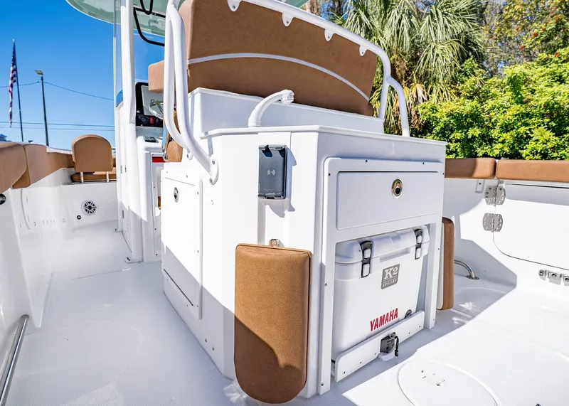 Slide: The Image of 2025 Sea Hunt Ultra 255 SE boat interior with seating and storage. - 15