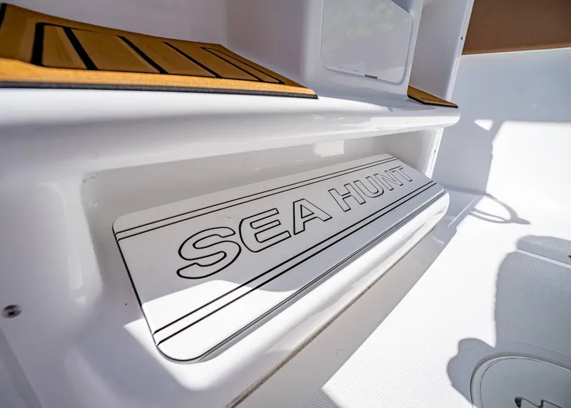 Slide: The Image of 2025 Sea Hunt Ultra 255 SE boat interior detail with logo. - 26