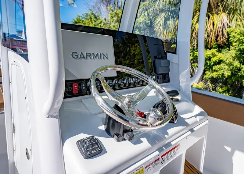 Slide: The Image of 2025 Sea Hunt Ultra 255 SE helm with Garmin navigation system. - 27