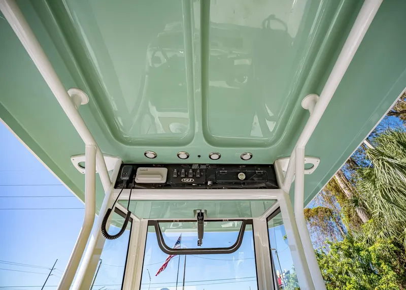 Slide: The Image of 2025 Sea Hunt Ultra 255 SE boat console with electronics and canopy. - 35