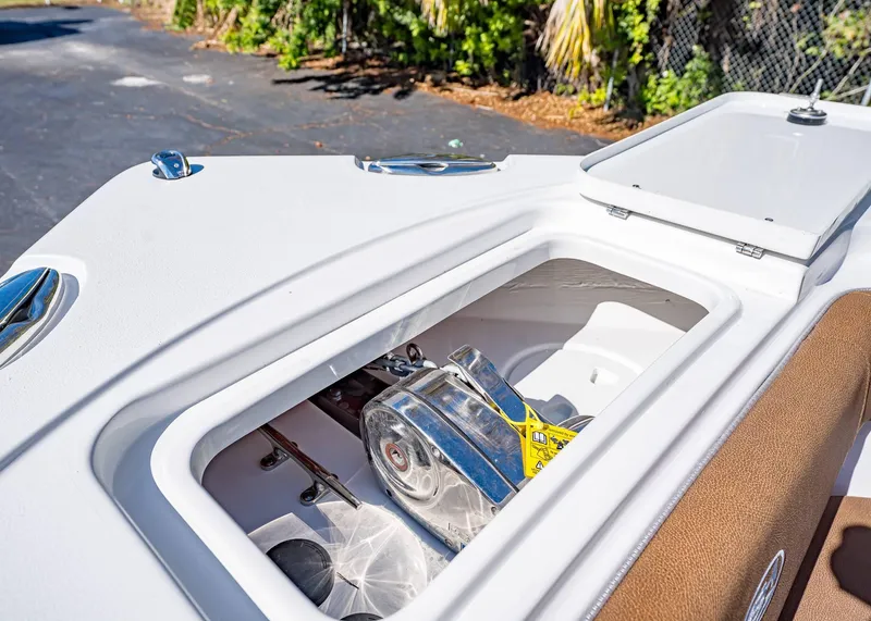 Slide: The Image of 2025 Sea Hunt Ultra 255 SE boat anchor compartment detail. - 46