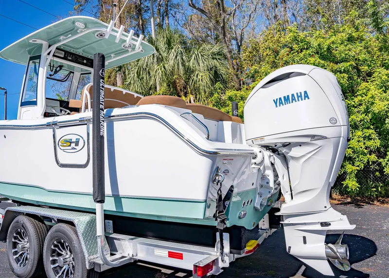 Slide: The Image of 2025 Sea Hunt Ultra 255 SE boat with Yamaha engine on trailer. - 6