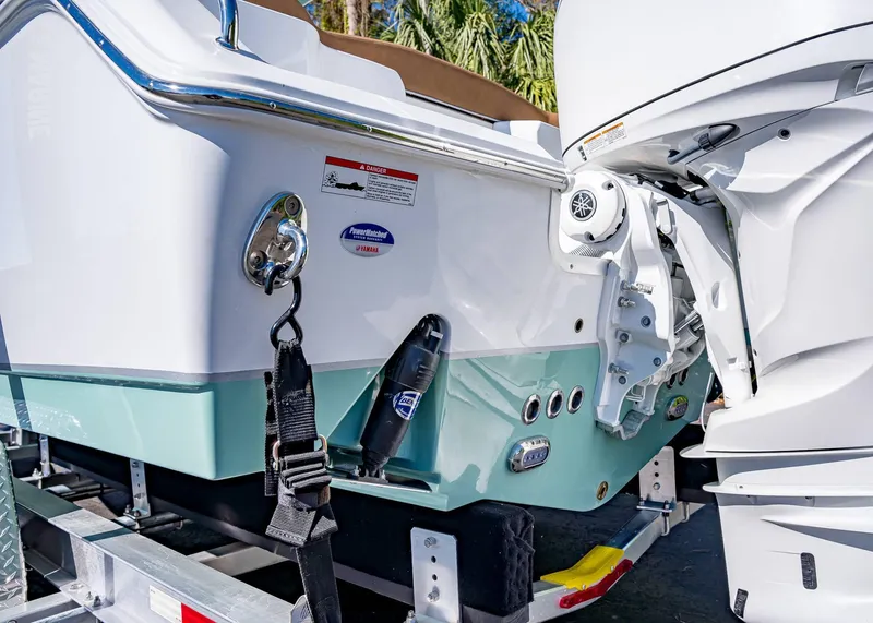 Slide: The Image of 2025 Sea Hunt Ultra 255 SE boat stern with Yamaha outboard motor on trailer. - 8