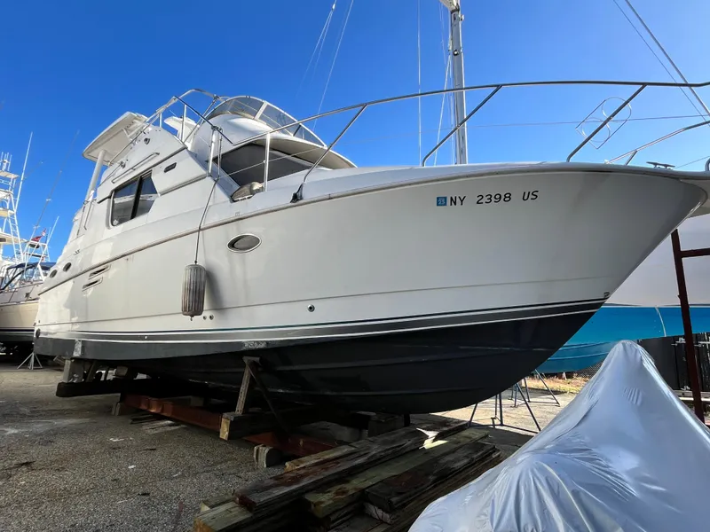 The Image of 1998 Silverton 322 Motor Yacht on dry dock, side view. - 1