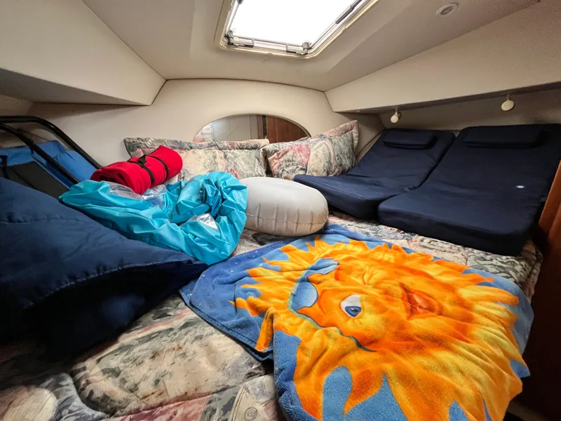 Slide: The Image of Cozy cabin interior of 1998 Silverton 322 Motor Yacht with colorful bedding and cushions. - 11