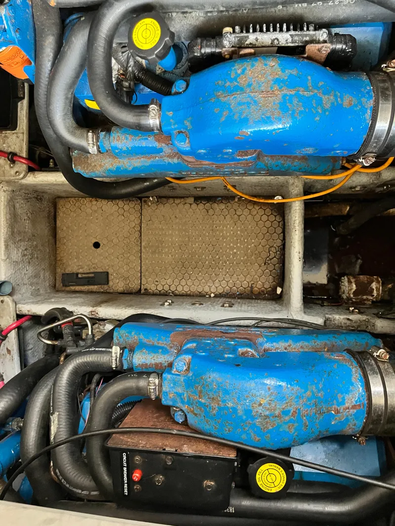 Slide: The Image of Engine compartment of a 1998 Silverton 322 Motor Yacht with visible blue components. - 16