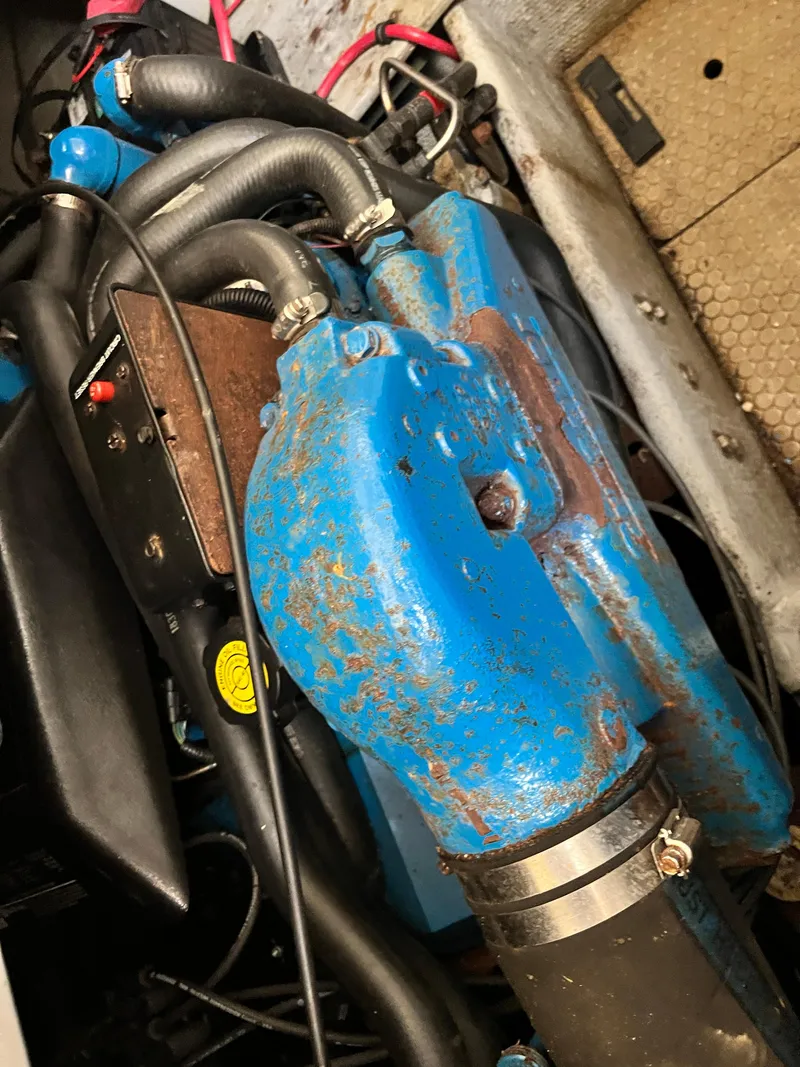 Slide: The Image of Close-up of 1998 Silverton 322 Motor Yacht engine with blue components. - 17