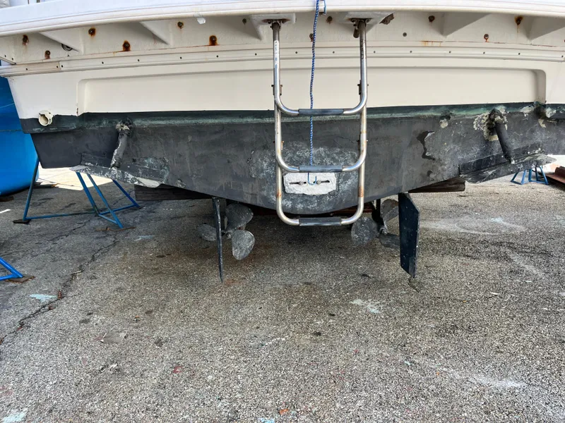 Slide: The Image of 1998 Silverton 322 Motor Yacht stern view with ladder and propellers visible. - 19