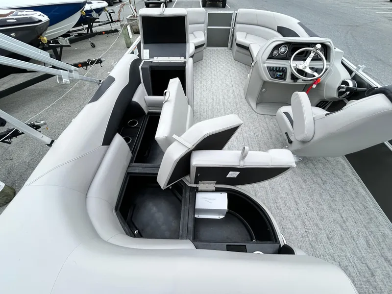 Slide: The Image of 2024 Berkshire 24RFC LE 2.75 pontoon boat interior with plush seating and modern helm. - 10