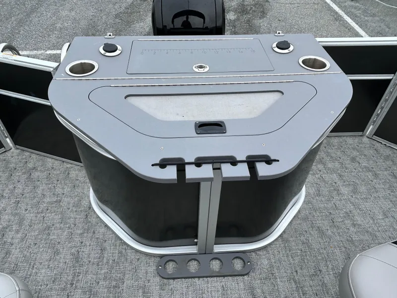 Slide: The Image of 2024 Berkshire 24RFC LE 2.75 boat interior with cup holders and storage. - 14