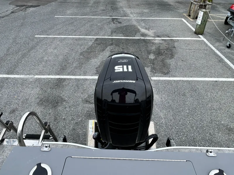 Slide: The Image of 2024 Berkshire 24RFC LE 2.75 with Mercury 115 outboard motor in parking lot. - 15