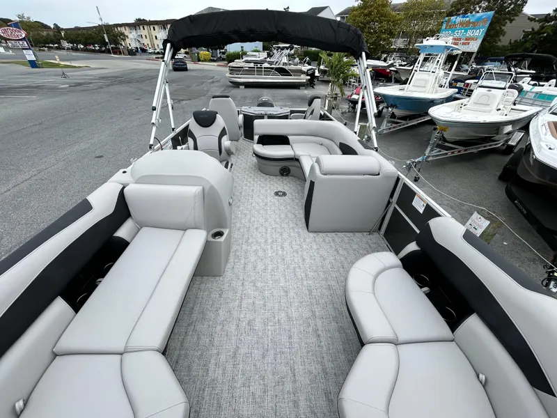 Slide: The Image of 2024 Berkshire 24RFC LE 2.75 pontoon boat with spacious seating and modern design. - 6