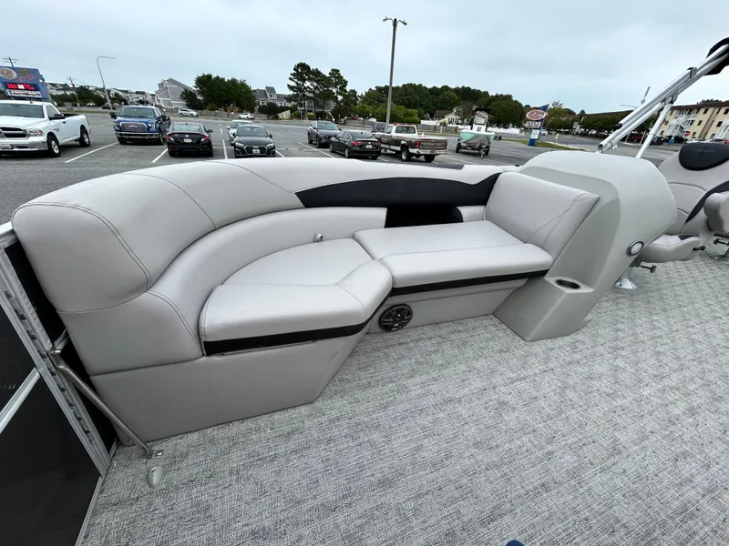 Slide: The Image of 2024 Berkshire 24RFC LE 2.75 pontoon boat with plush seating and modern design. - 7