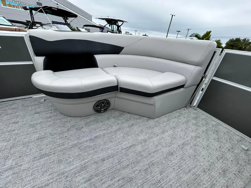 Slide: The Image of 2024 Berkshire 24RFC LE 2.75 boat interior with gray seating and carpet. - 8