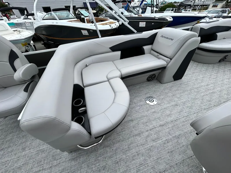 Slide: The Image of 2024 Berkshire 24RFC LE 2.75 pontoon boat with luxurious gray seating and cup holders. - 9