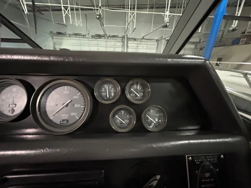 Slide: The Image of Dashboard gauges of a 1992 Sea Ray 370 Sundancer boat. - 15
