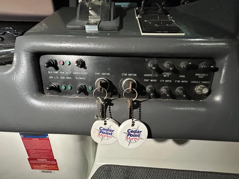 Slide: The Image of Control panel of a 1992 Sea Ray 370 Sundancer with Cedar Point keychains. - 16