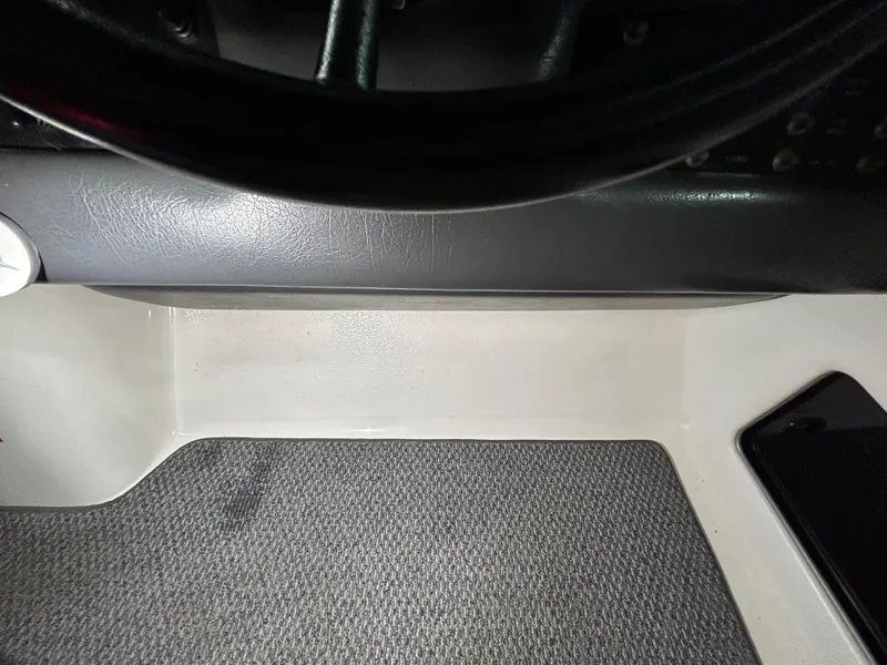 Slide: The Image of Interior view of a 1992 Sea Ray 370 Sundancer boat dashboard area. - 23