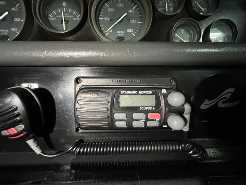 Slide: The Image of Control panel of a 1992 Sea Ray 370 Sundancer with Standard Horizon radio equipment. - 26