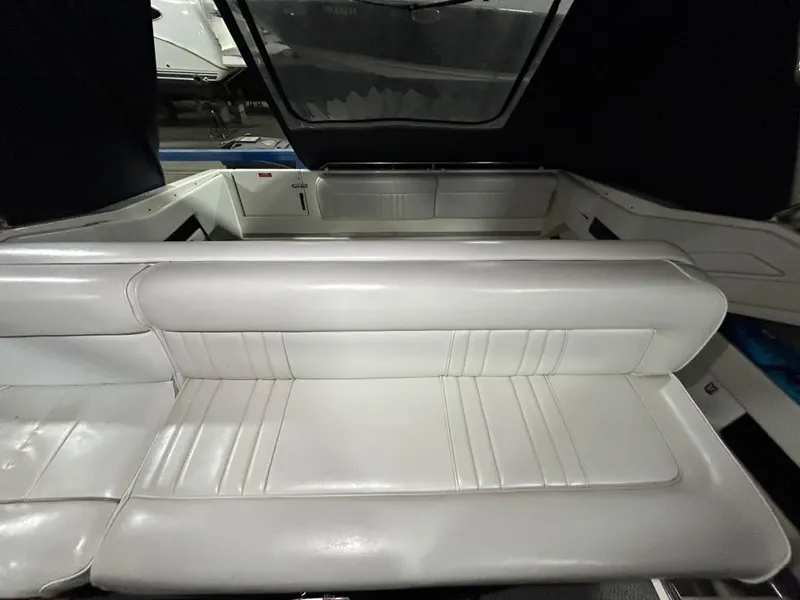 Slide: The Image of 1992 Sea Ray 370 Sundancer interior with white leather seating and spacious layout. - 28