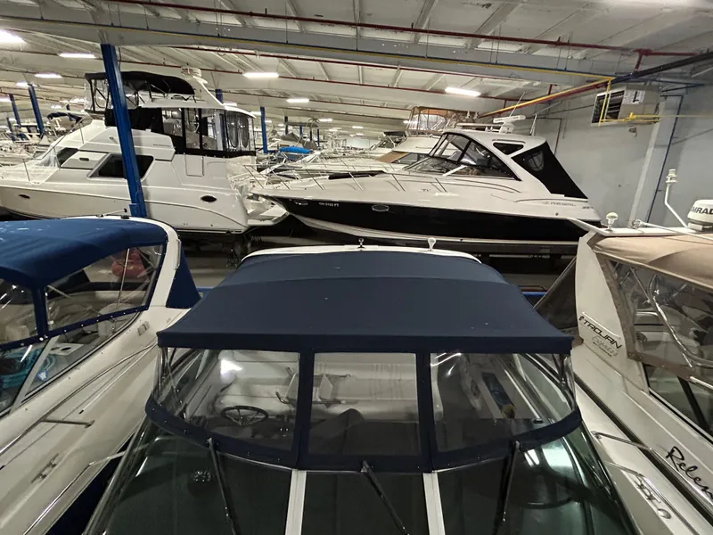 Slide: The Image of Indoor marina with multiple boats, featuring a 1992 Sea Ray 370 Sundancer. - 31