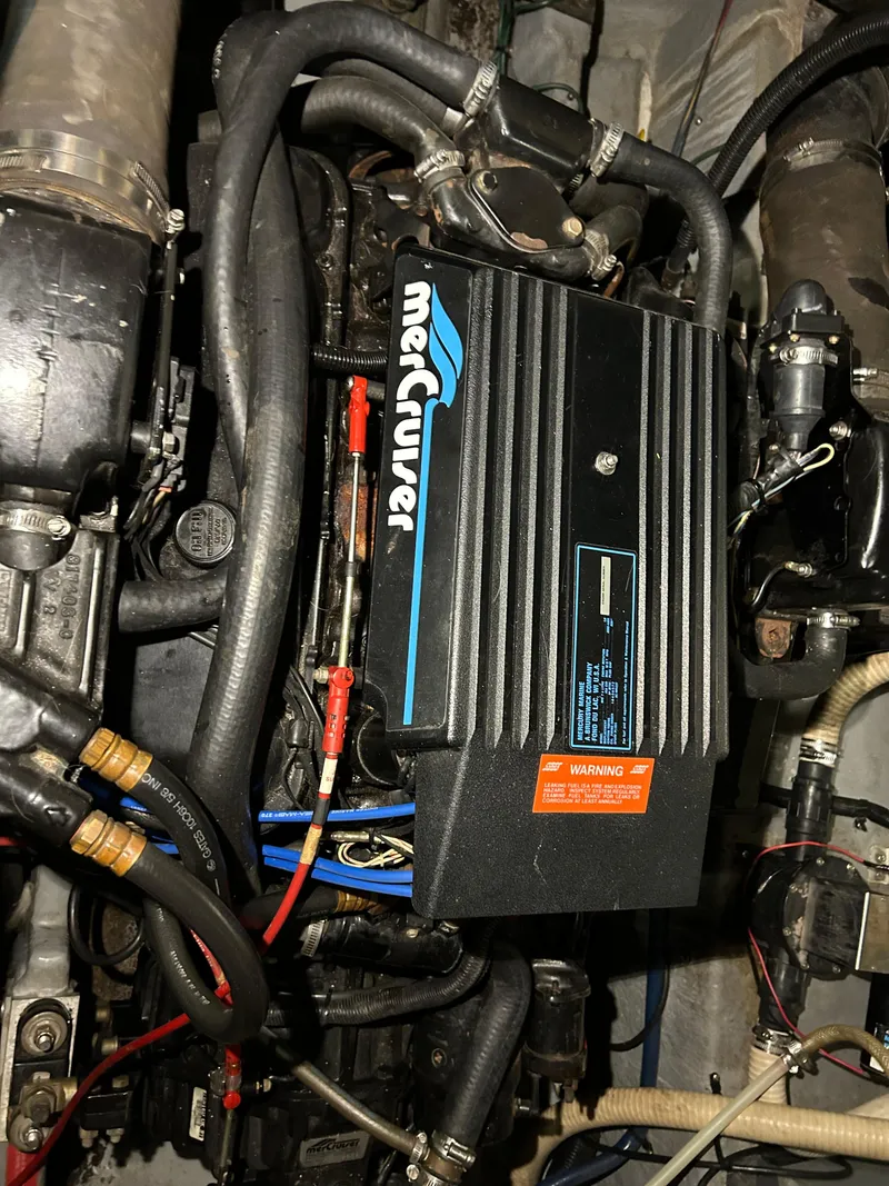 Slide: The Image of Engine compartment of a 1992 Sea Ray 370 Sundancer with MerCruiser components. - 36