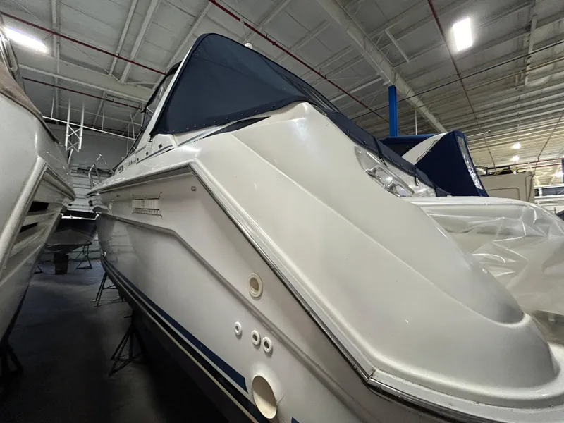 Slide: The Image of 1992 Sea Ray 370 Sundancer boat in indoor storage facility. - 41