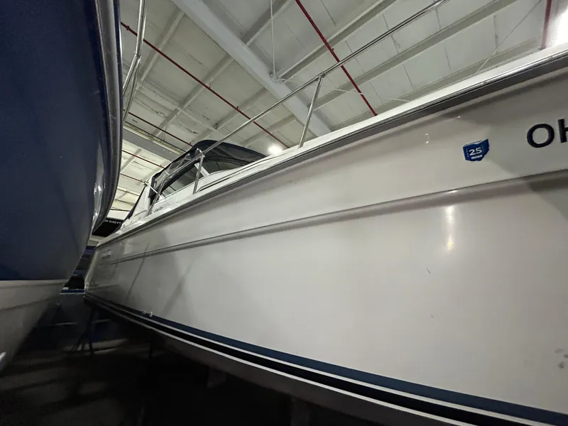 Slide: The Image of 1992 Sea Ray 370 Sundancer boat in indoor storage facility. - 42