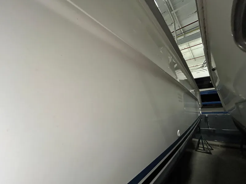 Slide: The Image of 1992 Sea Ray 370 Sundancer boat hull in storage, side view. - 43