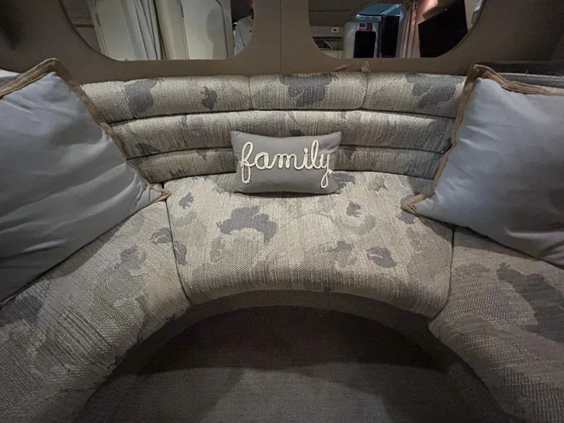 Slide: The Image of Interior seating area of a 1992 Sea Ray 370 Sundancer with "family" pillow. - 6