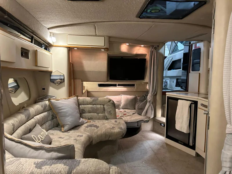 Slide: The Image of Luxurious interior of a 1992 Sea Ray 370 Sundancer yacht with cozy seating and modern amenities. - 8