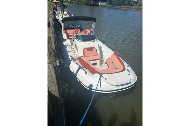Slide: The Image of 2026 Zodiac Medline 9 boat docked on a calm river. - 10