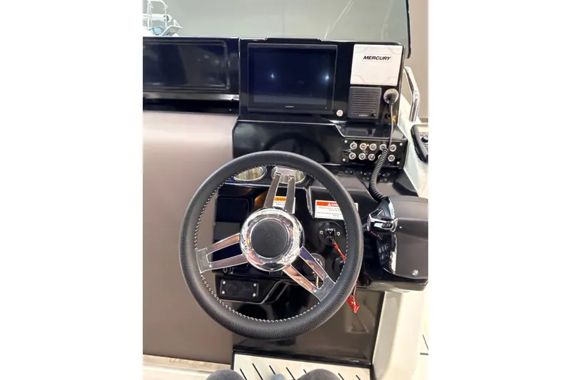 Slide: The Image of Steering console of 2025 Zodiac Medline 9 boat with Mercury controls. - 3