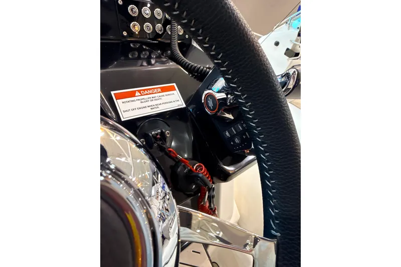 Slide: The Image of 2025 Zodiac Medline 9 dashboard with steering wheel and safety warning label. - 6
